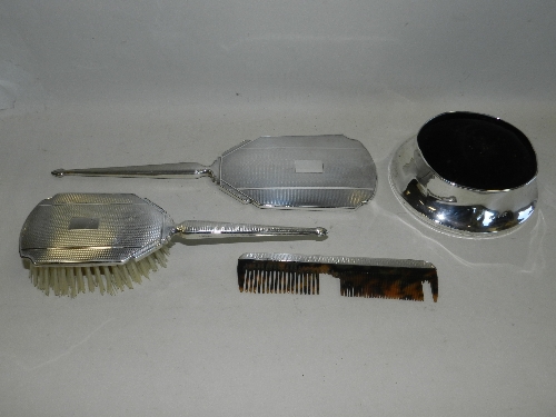 A silver mounted hand mirror, together with a silver mounted hair brush, comb and a silver mounted
