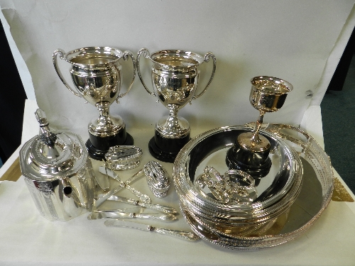 Two plated trophy cups; a tea port; a pair of plated entree dishes and covers; gallery tray, etc