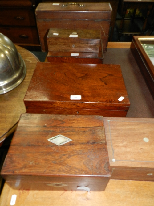 A rosewood glove box; a walnut writing slope; four other boxes