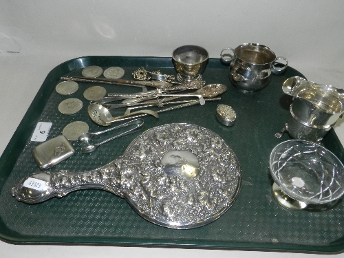 A Victorian silver twin handled bowl, (at fault); a silver cream jug; a footed bowl; a silver backed