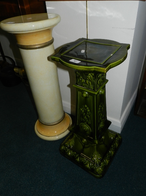 A Bretby green glazed jardiniere stand; a pottery jardiniere stand