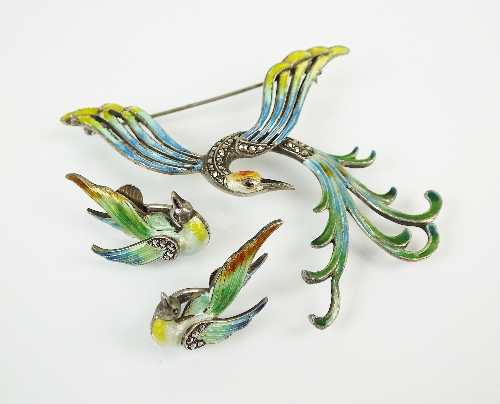 An enamel and marcasite bird of paradise brooch, the body set with marcasites with cream, black