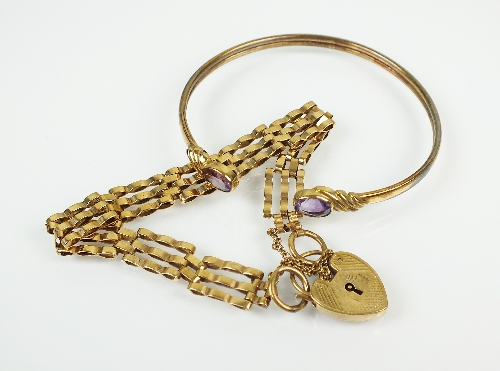 A 9ct gold three bar gate link bracelet, with heart shaped padlock clasp and attached safety