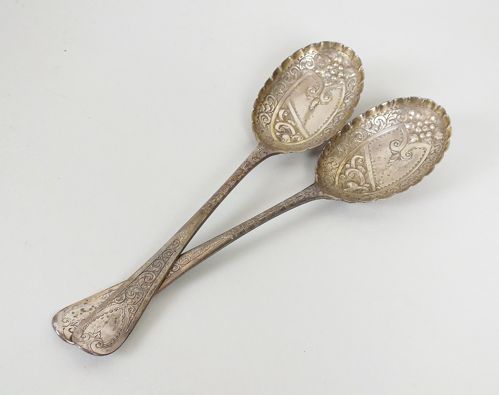 A pair of George III silver spoons, W.S., London 1792, each with bright cut engraved handles and