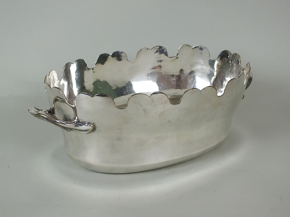 A 19th century silver plated two handled monteith, of oval form, 32cm wide (including handled)