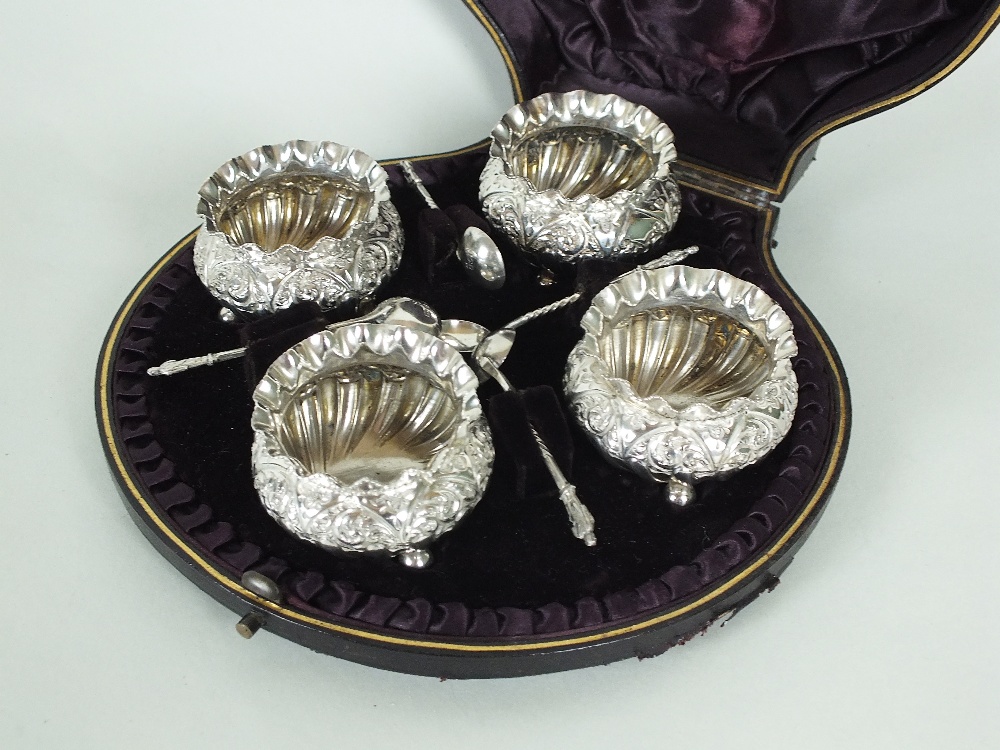 A cased set of four Victorian silver salts, Hayes Brothers, Birmingham 1890, each of embossed