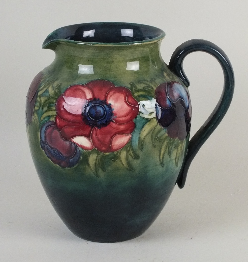 A William Moorcroft jug, in the Anemone pattern, circa 1930s/1940s, tubelined against a gradiated