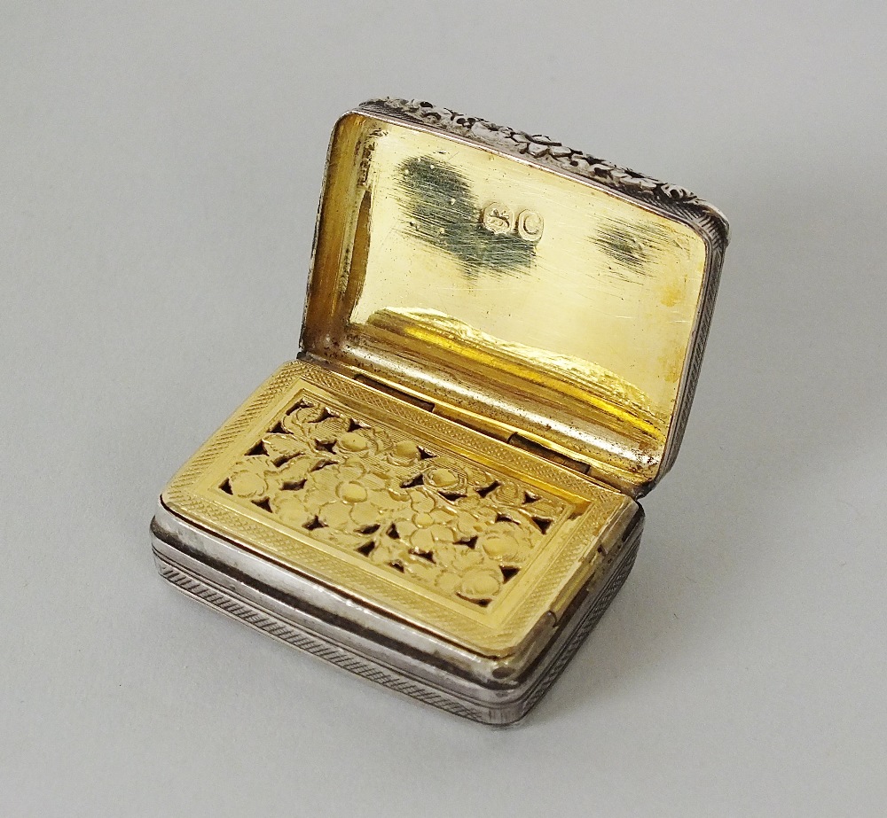 A George III silver vinaigrette, makers mark rubbed, London 1818, of engine turned rectangular