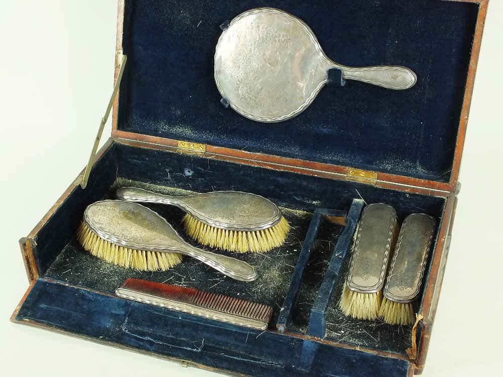 A cased six part silver mounted dressing table set, W G Sothers Ltd, Birmingham 1923, each piece