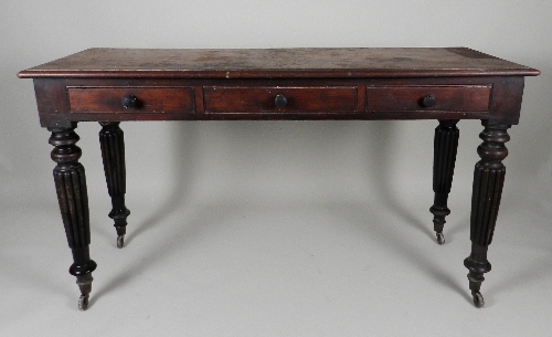 A William IV mahogany three drawer side table, the rectangular top with moulded edge over three