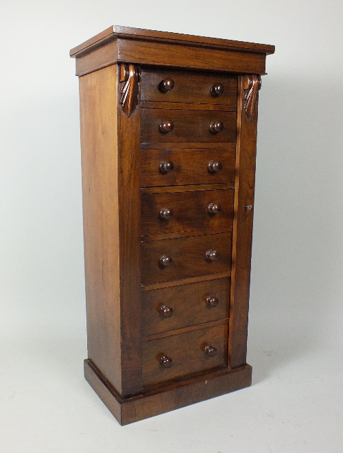A Victorian faux rosewood veneered Wellington chest of small proportions, the rectangular top over