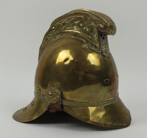 A Victorian Merryweather pattern brass fireman's helmet, lacking front badge, with partial leather