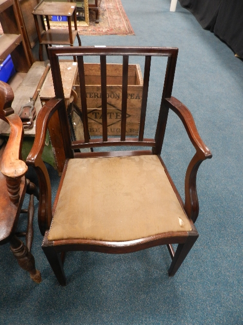 A George III mahogany carver dining chair with drop-in seat on tapered legs