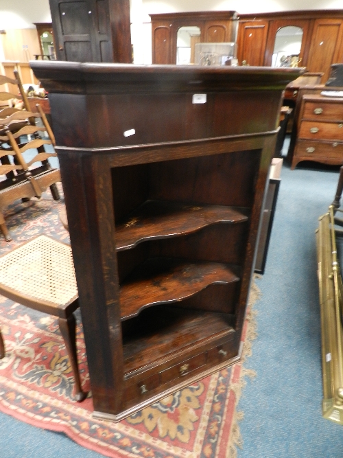 A George III oak and mahogany hanging corner cabinet