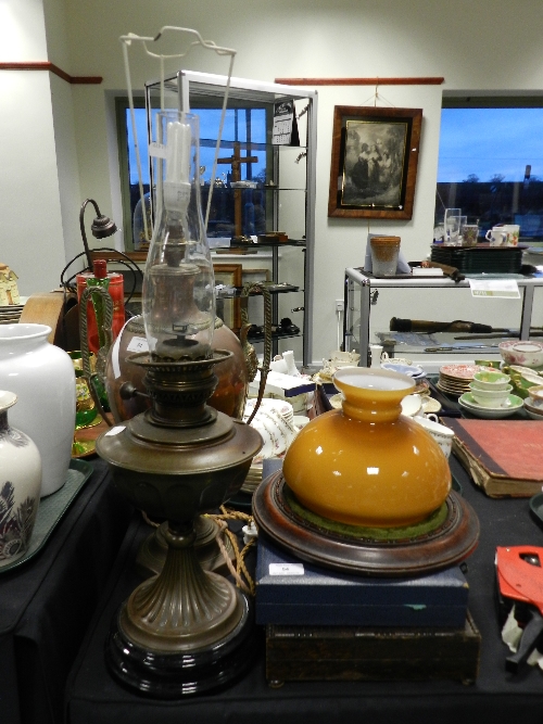 A 19th century copper tea urn converted to a lamp together with two brass oil lamps, a Victorian