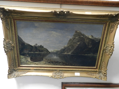 German School late 19th century oil on canvas, Mountain Lake Scene with fishing boat and houses