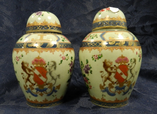 A pair of Samson porcelain ginger jars and covers decorated with pseudo armorials