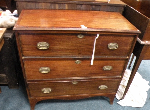 A George III crossbanded mahogany chest of three long drawers