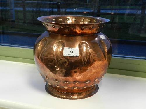 An Arts and Crafts hammered copper jardiniere