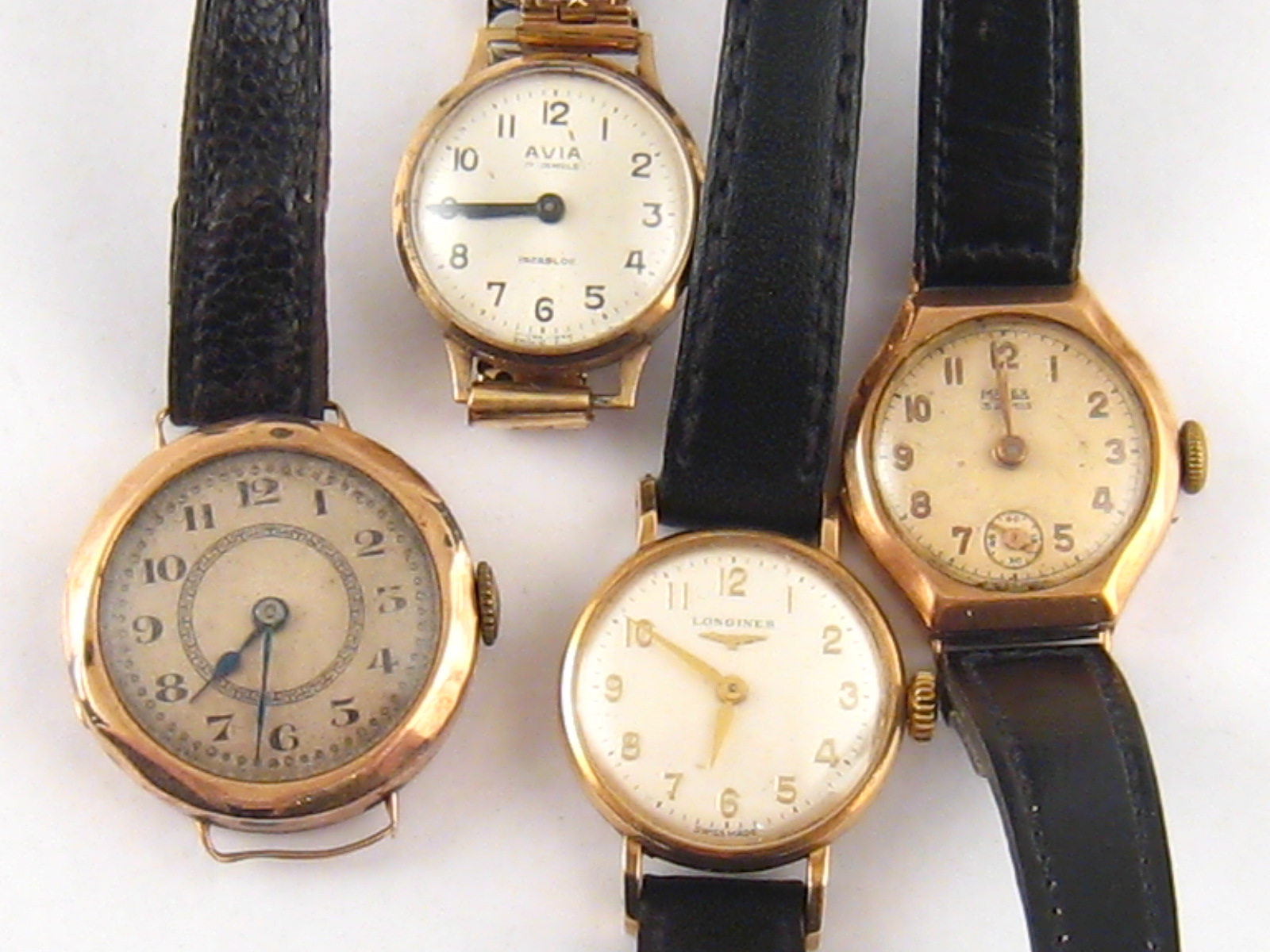 A mixed lot comprising four lady's 9 carat gold wrist watches including one Longines.