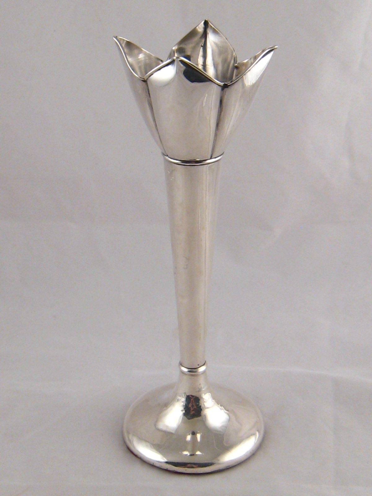 A tall specimen vase, the tapered stem rising to a quadrafoil calyx with stiffened  rim, Birmingham,