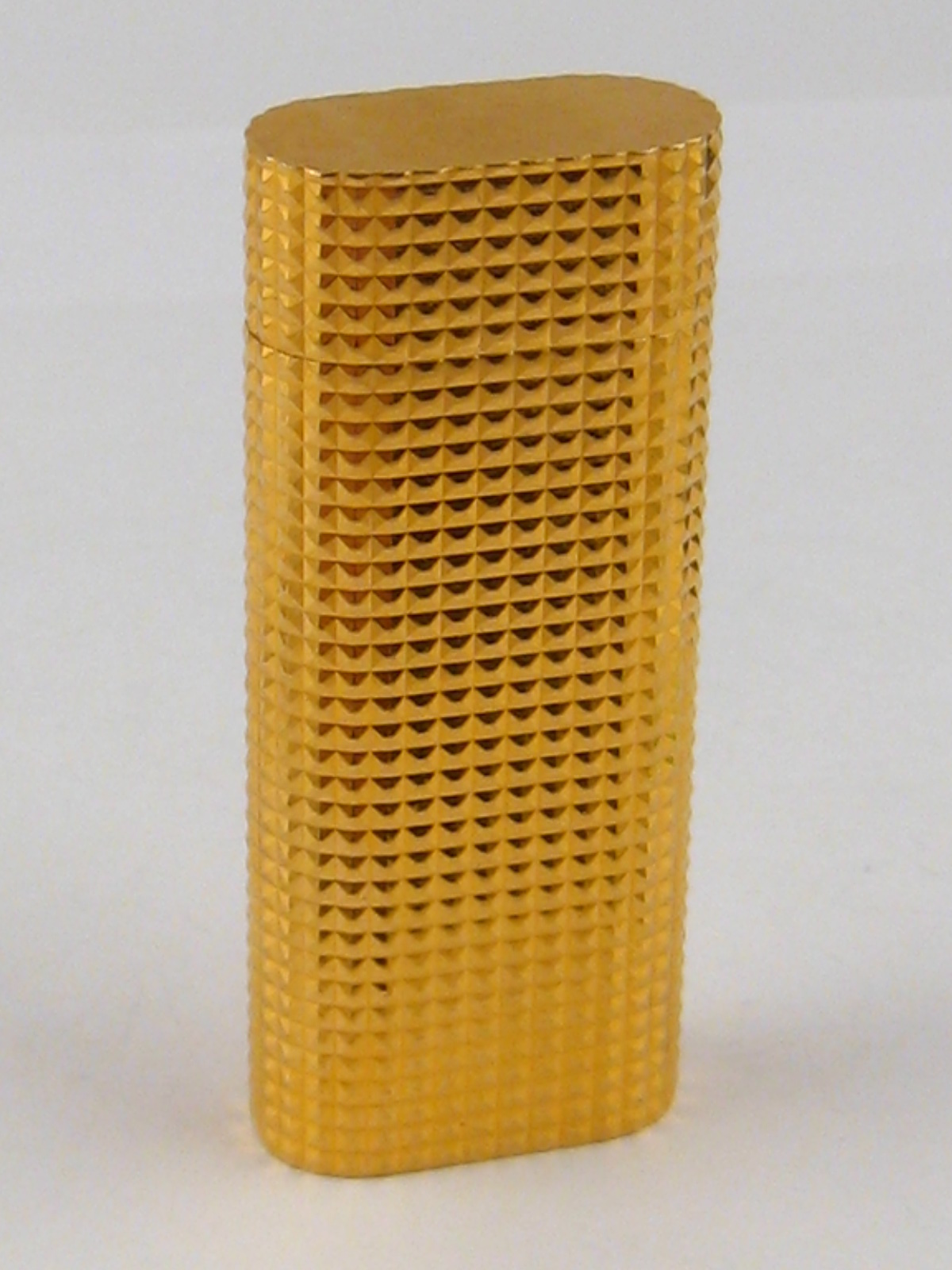 Cartier. A gold plated cigarette lighter by Cartier, signed Cartier Paris and numbered E45272,