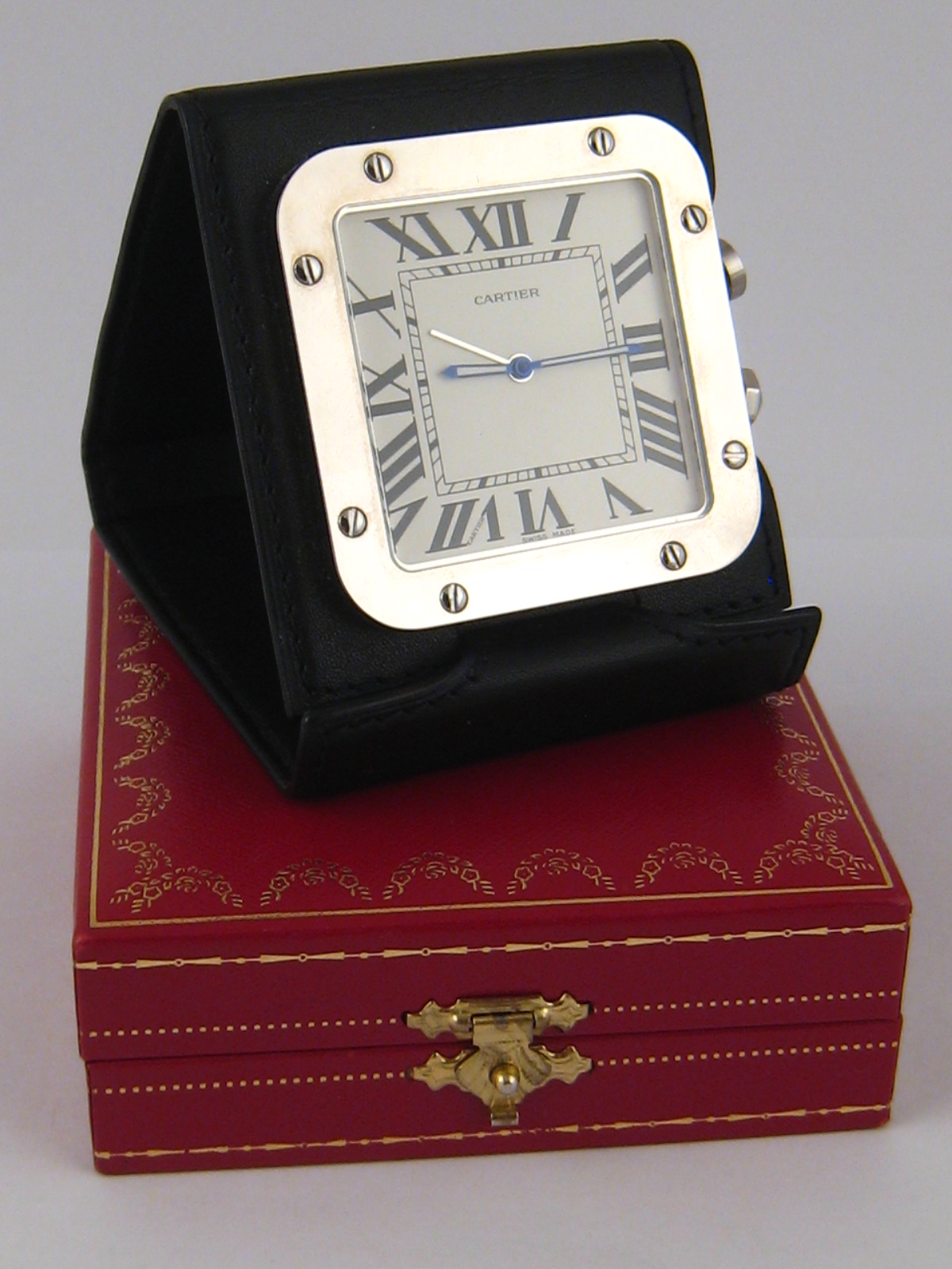 Cartier. A stainless steel travelling alarm clock by Cartier, numbered 014997UM  2750, case approx