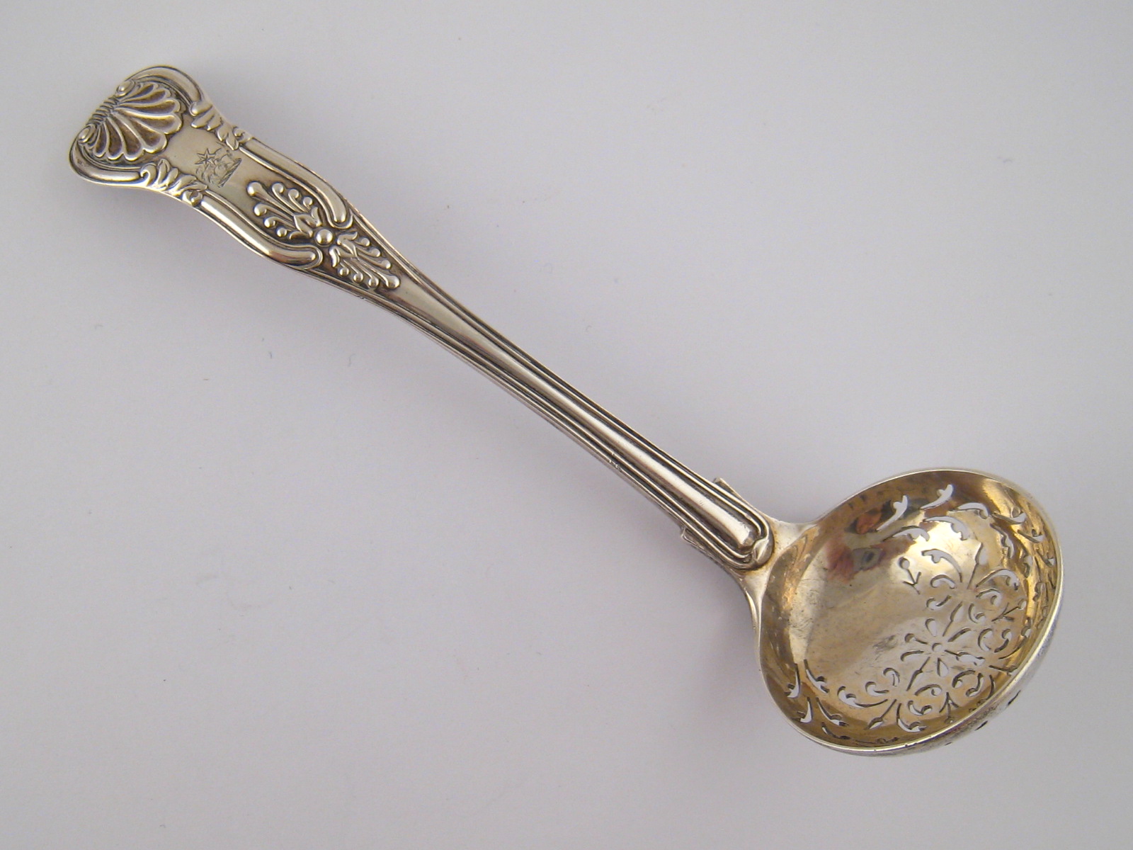 A late Victorian silver King's pattern, shell heel, sifter ladle, by Holland, Aldwinckle and Slater,