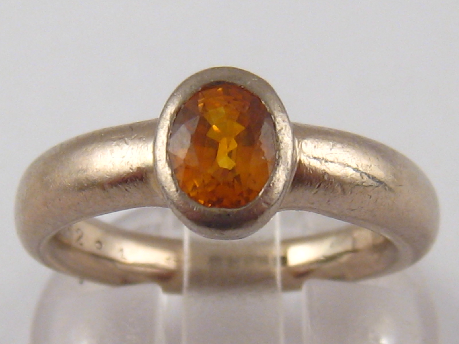 An 18 carat white gold citrine ring, citrine approx 6.5 x 4.8mm, ring size K, 9.1 gms.