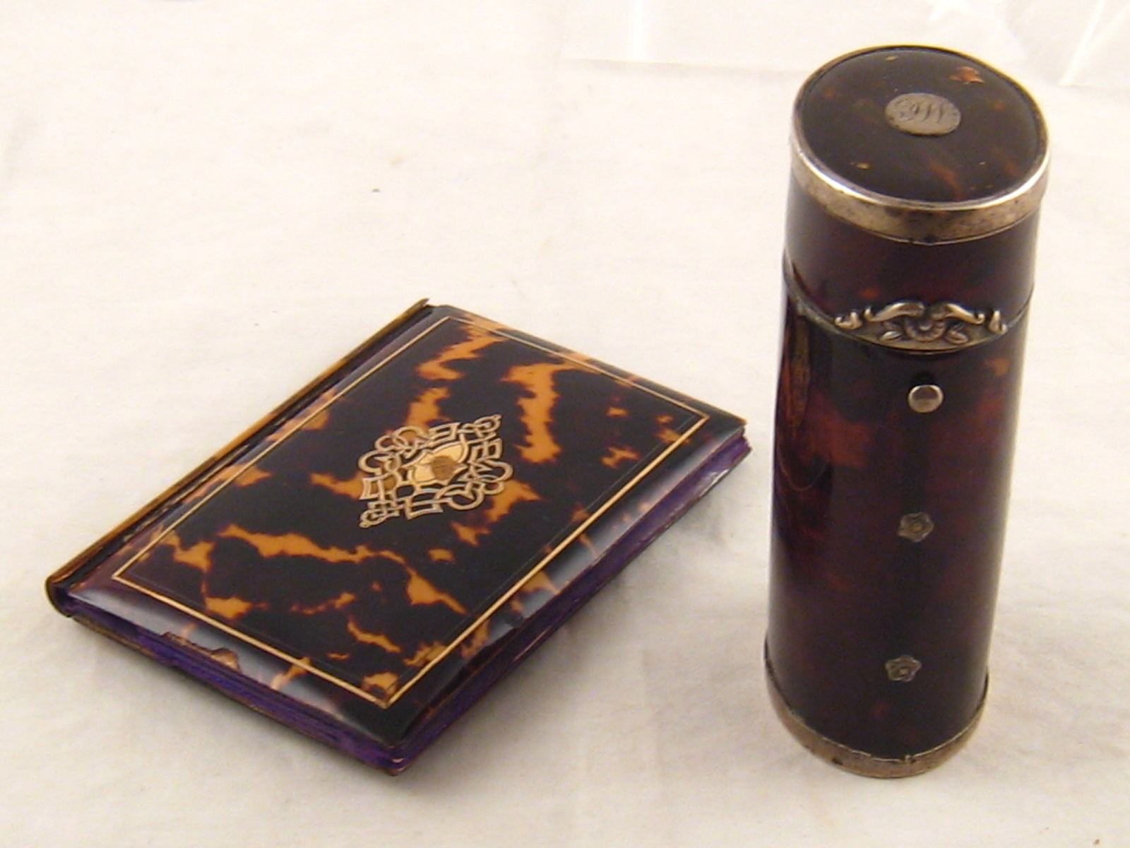 An antique silver mounted tortoiseshell box, approx 10cm high, together with a tortoiseshell note