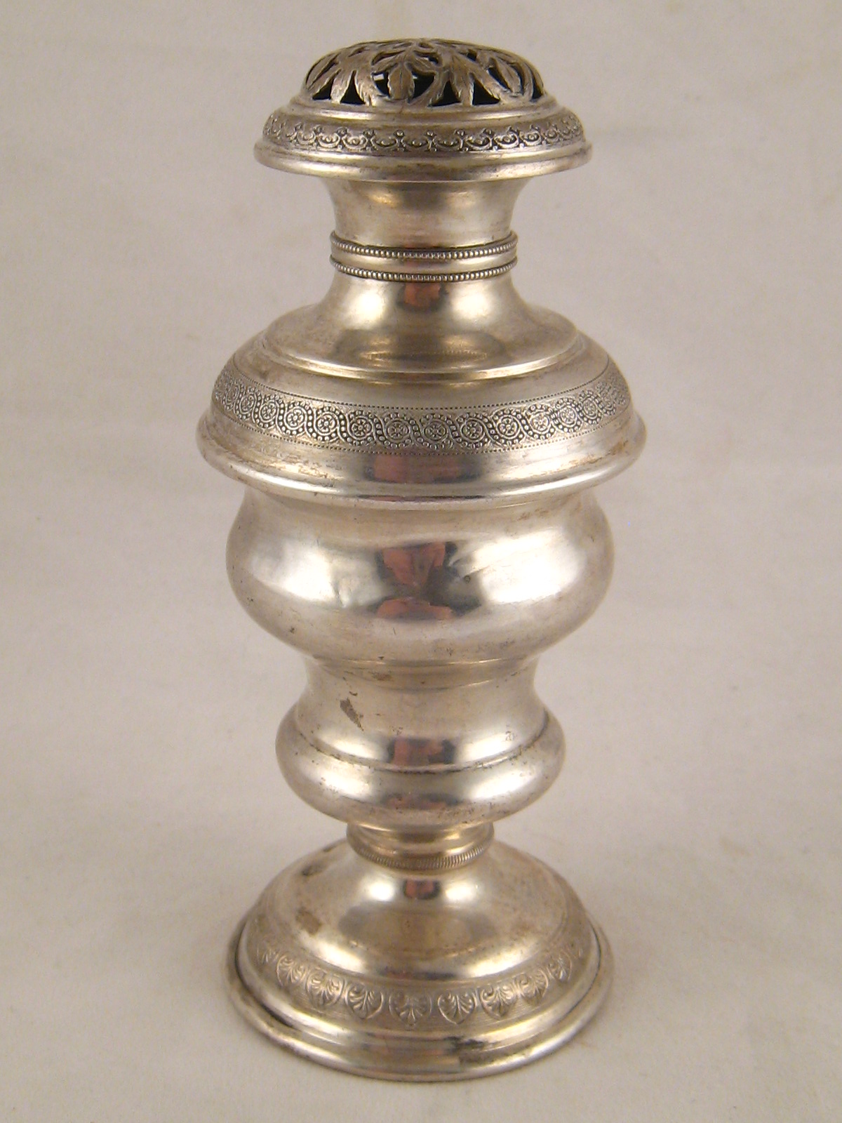 A Continental silver, 812 standard, caster with pierced decorated top, assay marks for Budapest,