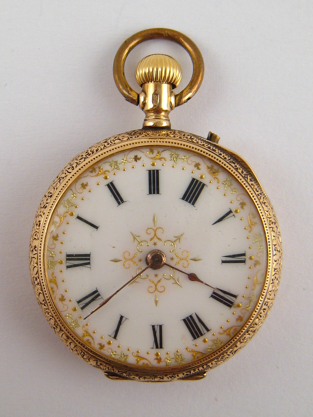 A 14 carat gold cased fob watch with enamel dial, metal dust cover, case approx 33mm wide.