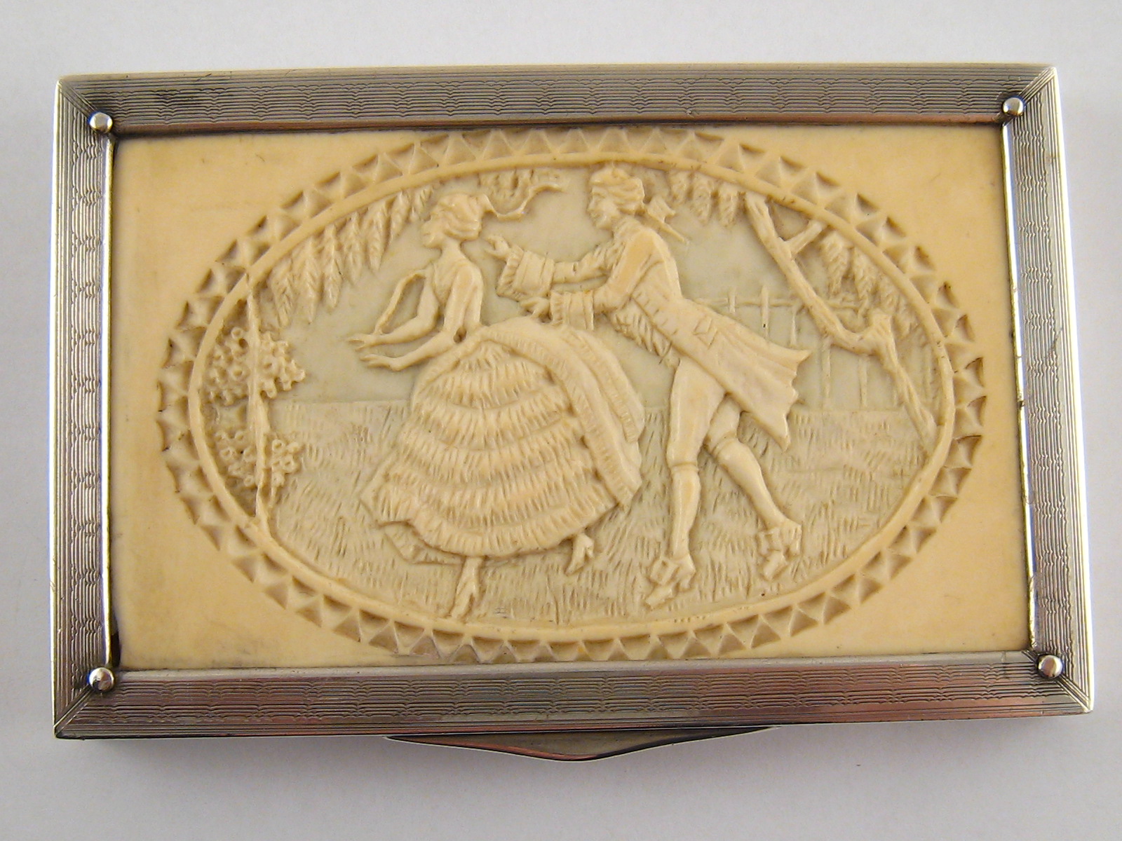 An Austrian silver, 935 standard, rectangular box, the lid an inset ivory panel with fine oval