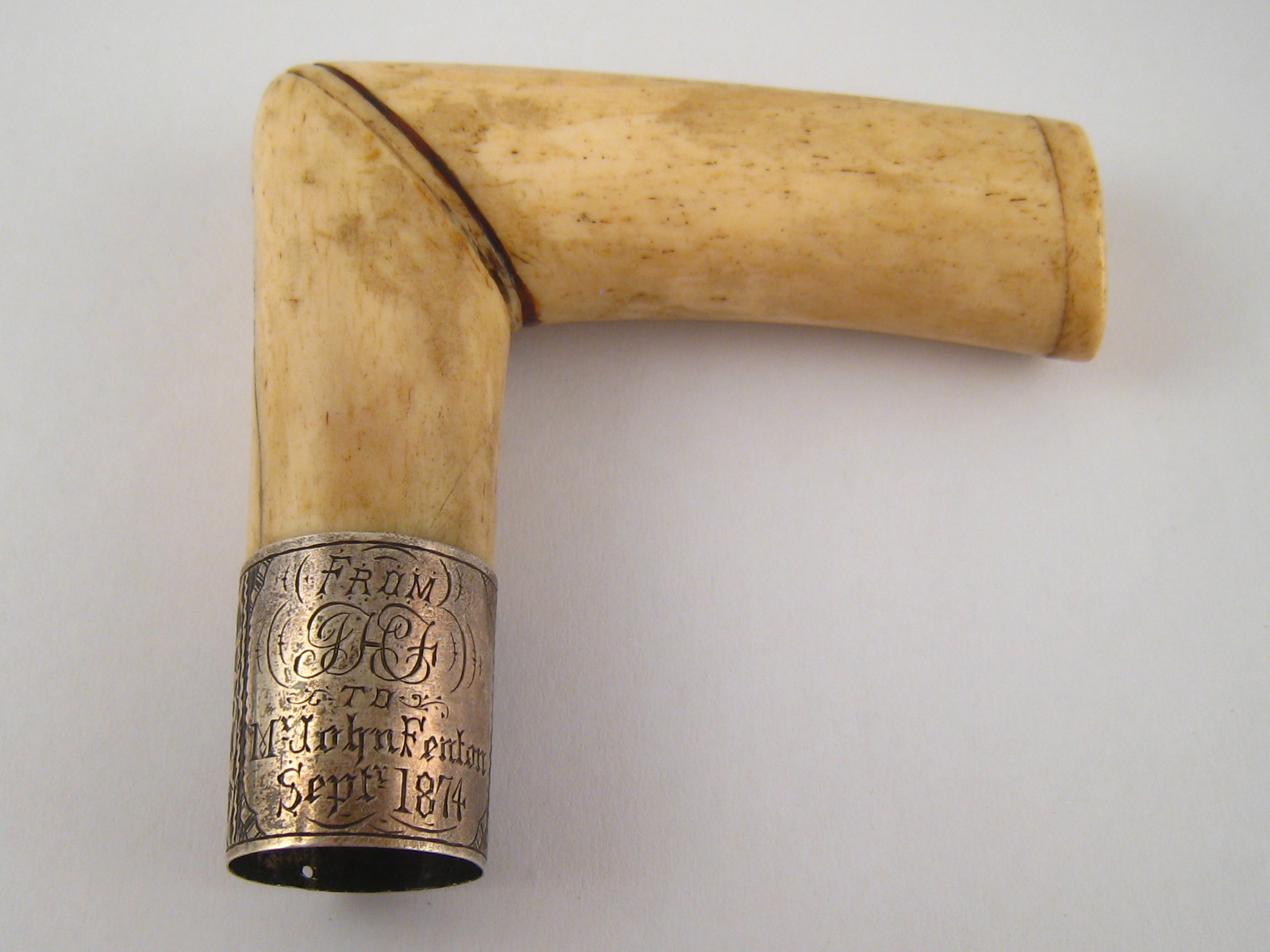 A silver mounted bone cane or parasol handle, engraved dedication dated 1874, approx 8x7x2.5cm