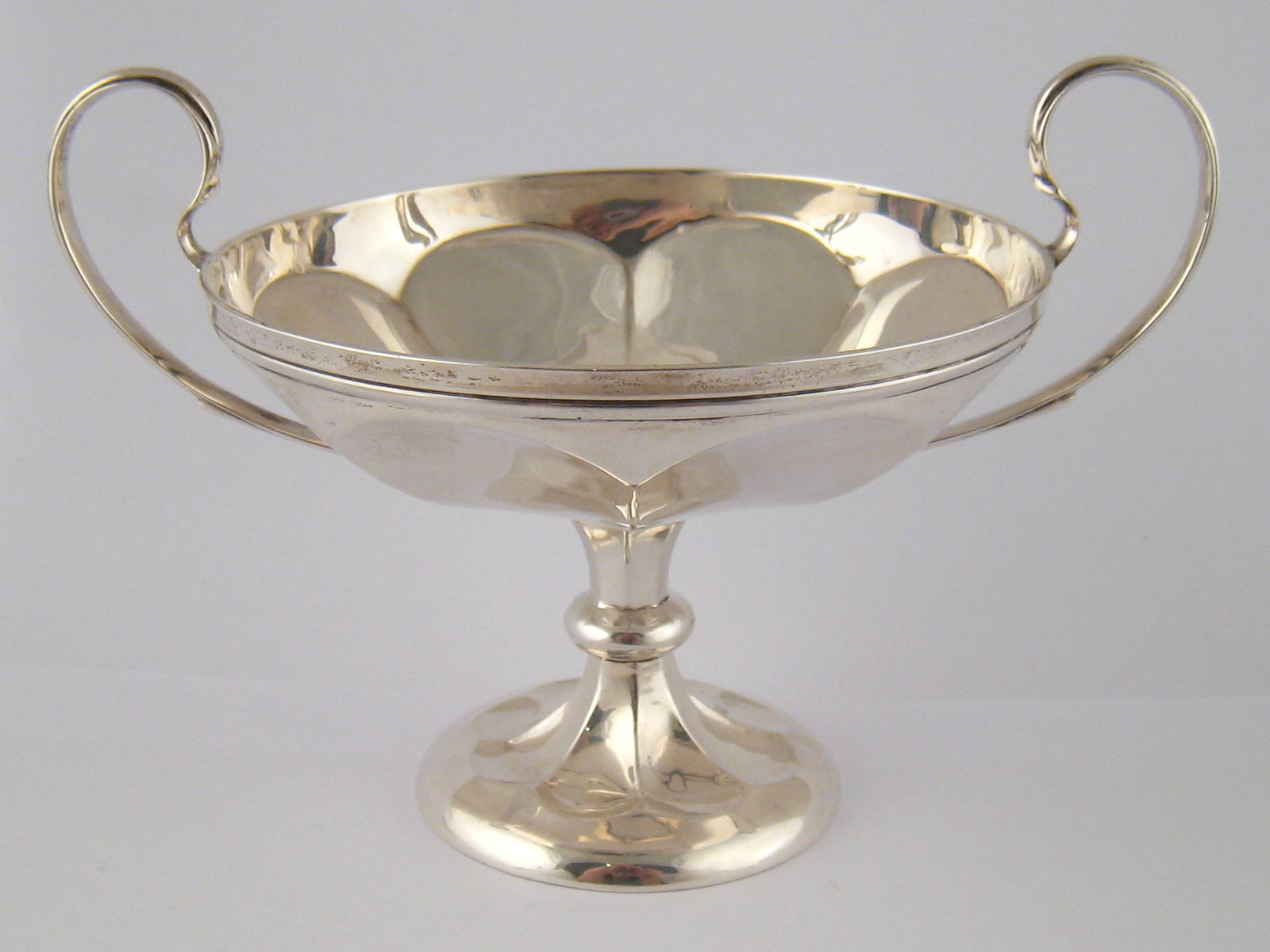A silver two handled eight panelled tazza by Mappin and Webb, Birmingham 1910. 18cm. across, wt.