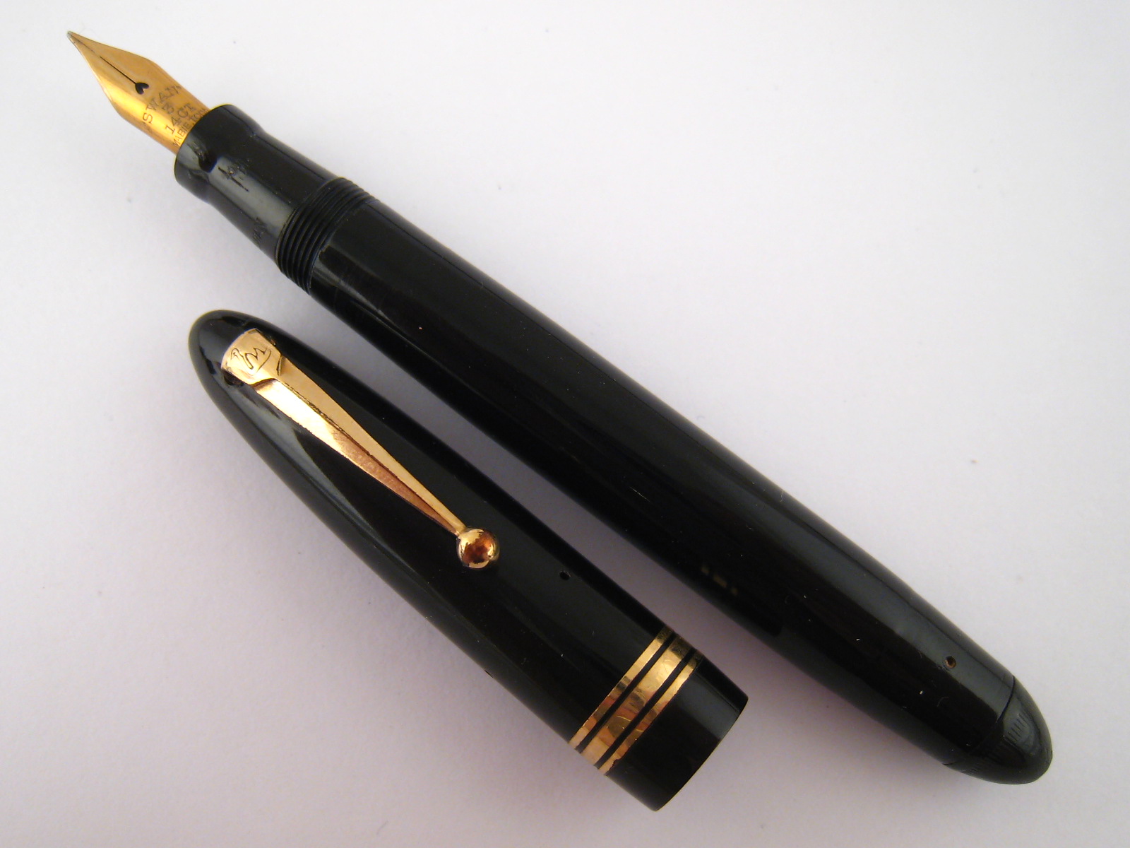A Swan model 1060 twist filling torpedo design fountain pen, Swan 14 ct gold nib, circa 1950.