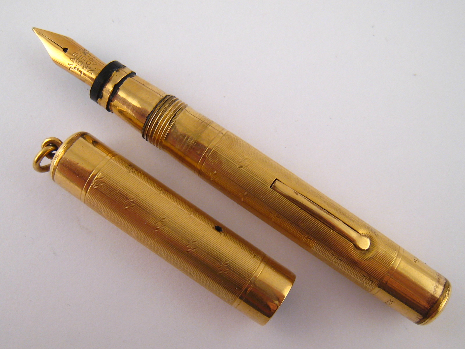 A rolled gold Lady's ring top Swan Mabie Todd New York fountain pen, lever fill, 14 ct gold nib,
