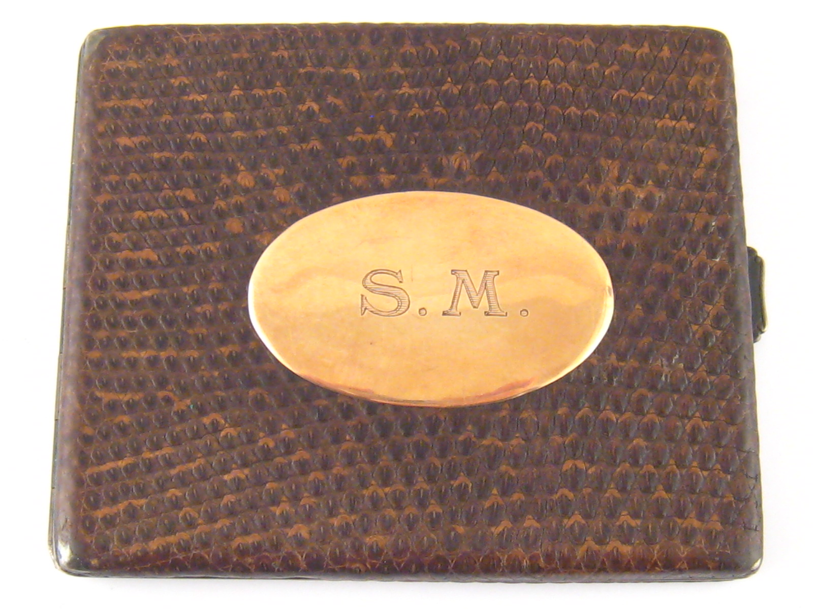 A snake skin covered German hallmarked 925 standard silver cigarette case with a yellow metal (tests