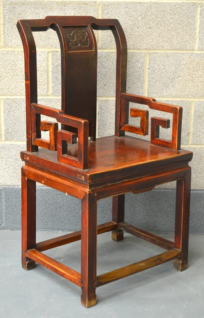 A CHINESE QING DYNASTY LACQUERED SOFTWOOD ARMCHAIR Ming Style, with carved panel, angular arms and