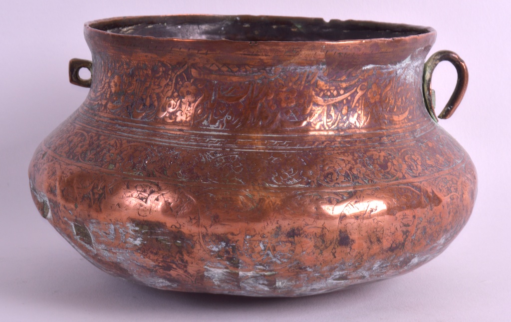 A 17TH/18TH CENTURY SAFAVID CIRCULAR COPPER BOWL Persia, engraved with extensive foliage and