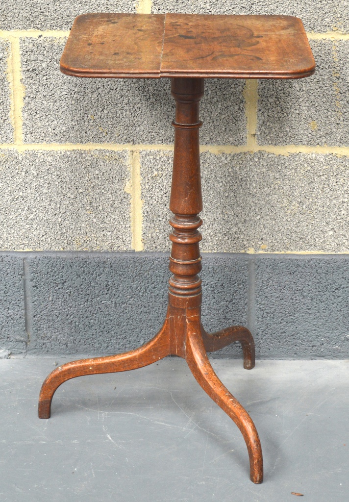 AN EDWARDIAN CARVED MAHOGANY TILT TOP OCCASIONAL TABLE with square top and triple splayed