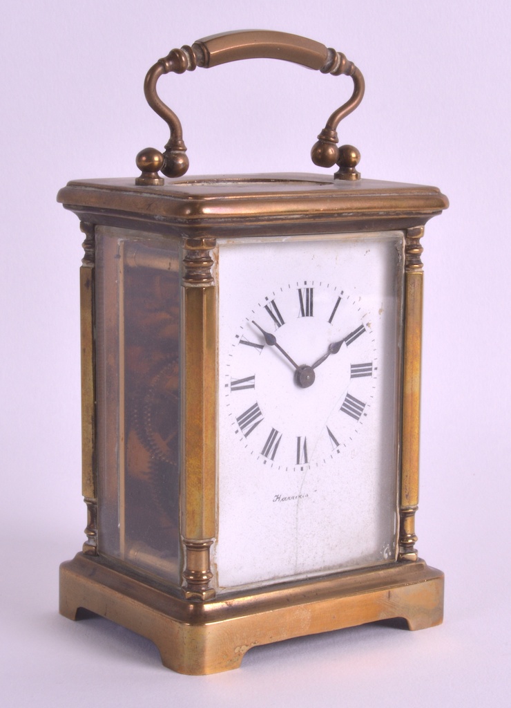 A LATE 19TH CENTURY FRENCH BRASS CARRIAGE CLOCK with white enamel dial and black painted numerals.