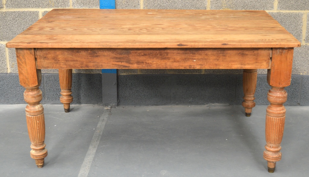 A VICTORIAN AND LATER PINE FARMHOUSE KITCHEN TABLE of square form, with five plank top upon reeded