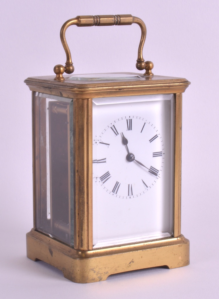 A LATE 19TH CENTURY FRENCH BRASS CARRIAGE CLOCK with white enamel dial , black painted numerals