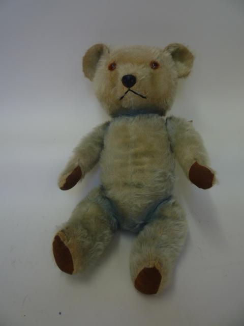 Teddies & Soft Toys. An English Chiltern teddy bear, early to mid 20th century, covered in faded