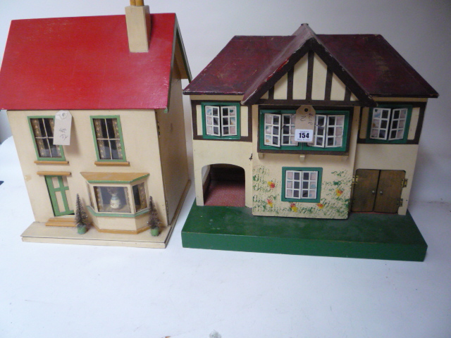 Dolls & Equipment. A Triang dolls house, painted wood half timbered construction with gabled roof,