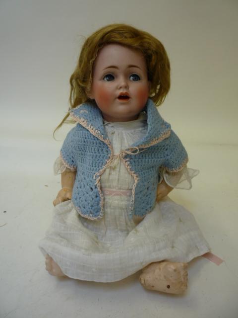 Dolls & Equipment. A J D Kestner bisque head flirty eyed character doll with blue glass eyes, open