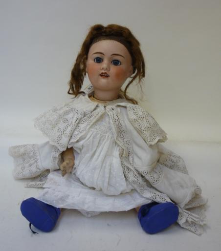 Dolls & Equipment. A J. Verlingue bisque head doll with fixed blue glass eyes, open mouth and teeth,