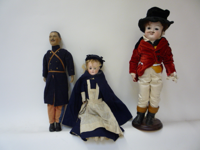 Dolls & Equipment. A bisque shoulder head doll with fixed brown glass eyes, open mouth and teeth,