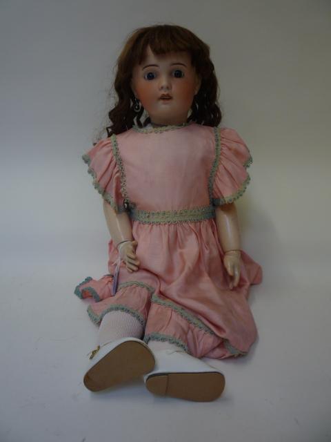 Dolls & Equipment. An S.F.B.J. bisque head girl doll with fixed blue glass eyes, open mouth and